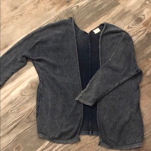 a blue cardigan